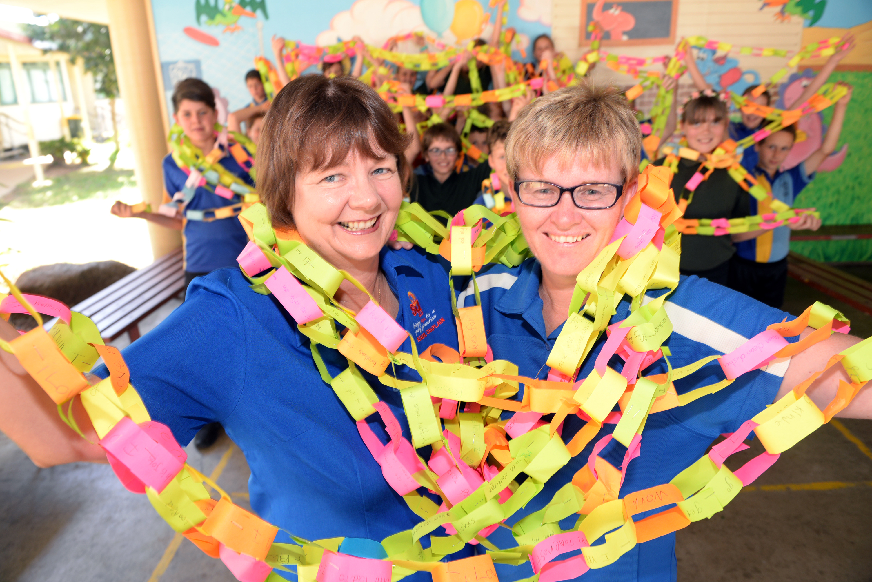 PAPER CHAIN: Kalkie State School staff Marion Crane and Carolyn Caldwell and students helped make a Random Acts of Kindness Chain.
Photo: Max Fleet / NewsMail PAPER CHAIN: Kalkie State School staff Marion Crane and Carolyn Caldwell and students helped make a Random Acts of Kindness Chain.
Photo: Max Fleet / NewsMail