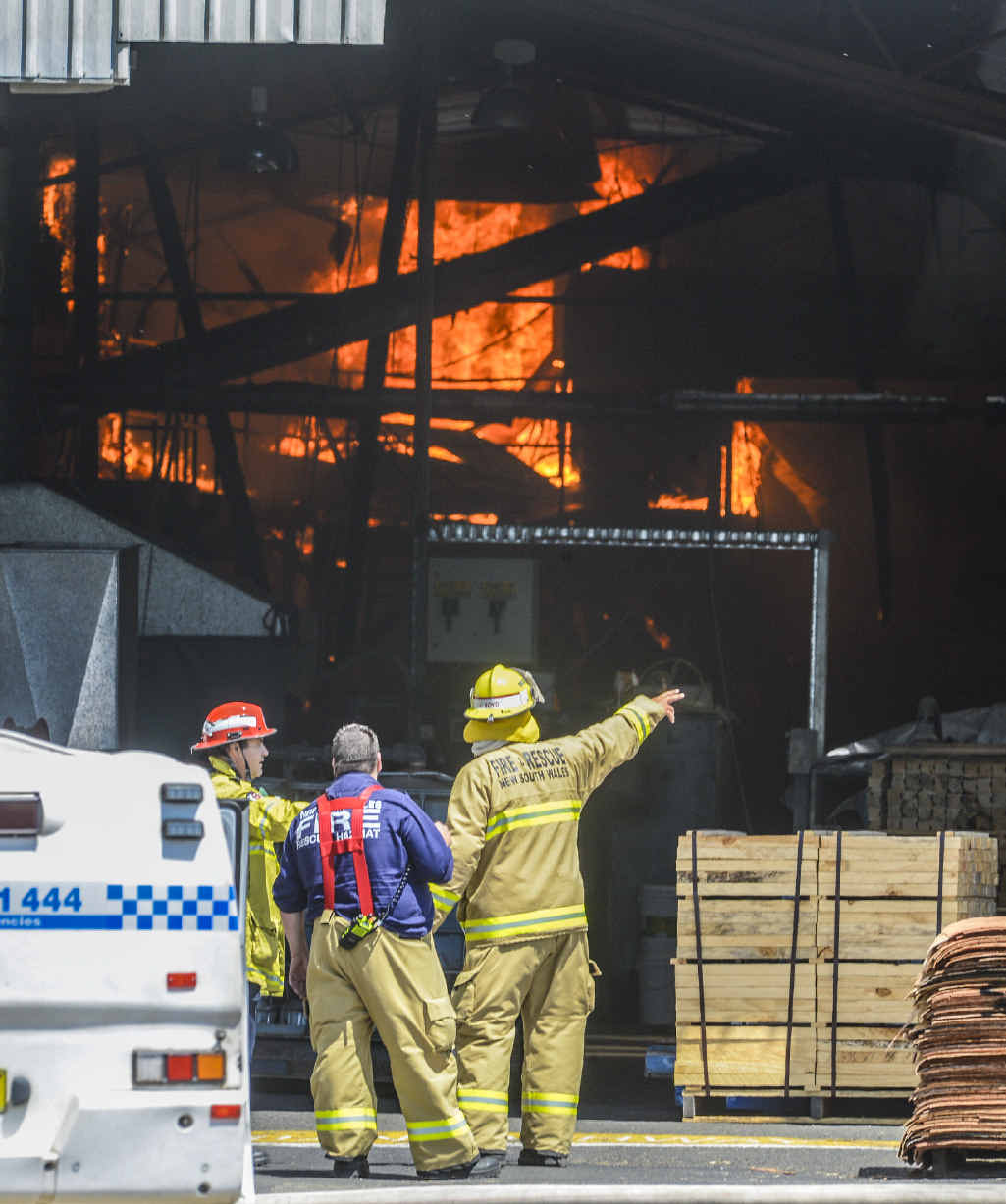 Firefighters plan their attack on the blaze at Big River Timbers. Firefighters plan their attack on the blaze at Big River Timbers.