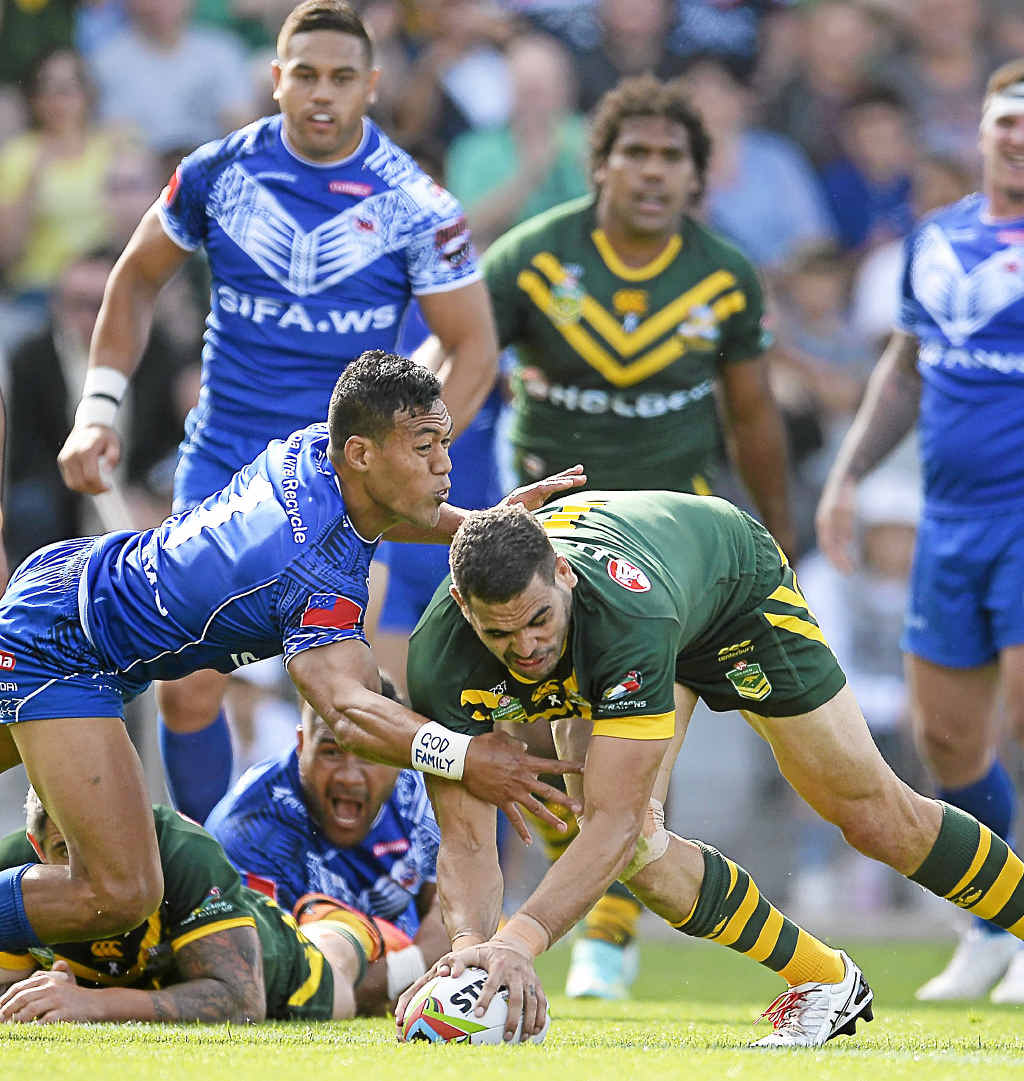 Australia’s Greg Inglis scores a try in the win over Samoa yesterday. Australia’s Greg Inglis scores a try in the win over Samoa yesterday.