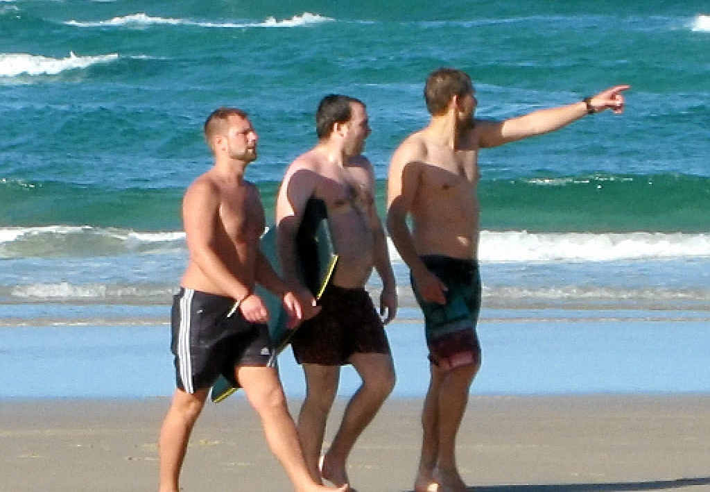 LUCKY: Chris Appelkamp (right) rescued this unnamed English tourist (centre) and a friend from a rip at Broken Head on Saturday. Another tourist (left) struggled, but made it to shore. LUCKY: Chris Appelkamp (right) rescued this unnamed English tourist (centre) and a friend from a rip at Broken Head on Saturday. Another tourist (left) struggled, but made it to shore.