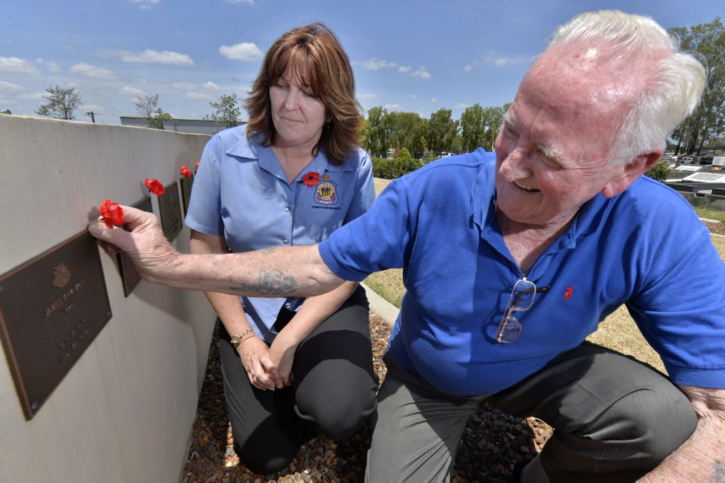 Debbie Wadwell and Matt Rennie laying poppies at the Ipswich Cemetary for Remembrance Day. Debbie Wadwell and Matt Rennie laying poppies at the Ipswich Cemetary for Remembrance Day.