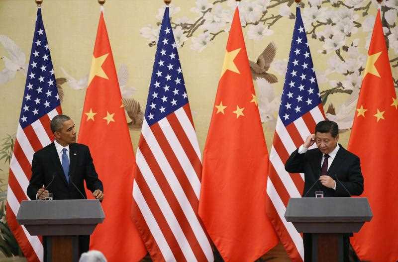 US President Barack Obama (L) speaks as Chinese President Xi Jinping adjusts his headphones during a press conference at the Great Hall of the People (GHOP) in Beijing, China, 12 November 2014. Obama is in China to attend the Asia-Pacific Economic Cooperation (APEC) 2014 Summit and related meetings. Obama and Xi announced new climate change targets at the end of their two-day talks in Beijing. US President Barack Obama (L) speaks as Chinese President Xi Jinping adjusts his headphones during a press conference at the Great Hall of the People (GHOP) in Beijing, China, 12 November 2014. Obama is in China to attend the Asia-Pacific Economic Cooperation (APEC) 2014 Summit and related meetings. Obama and Xi announced new climate change targets at the end of their two-day talks in Beijing.