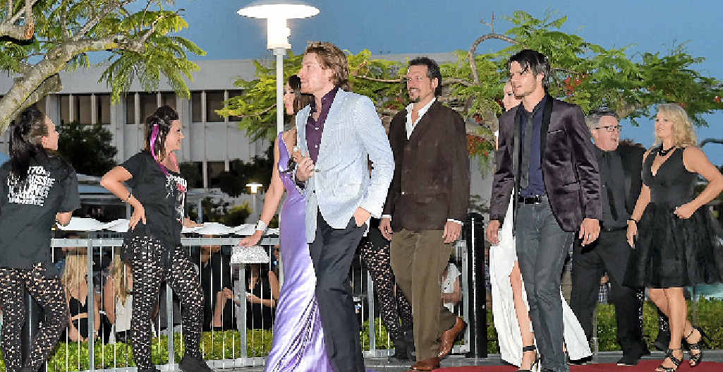 The cast arrives on the red carpet.