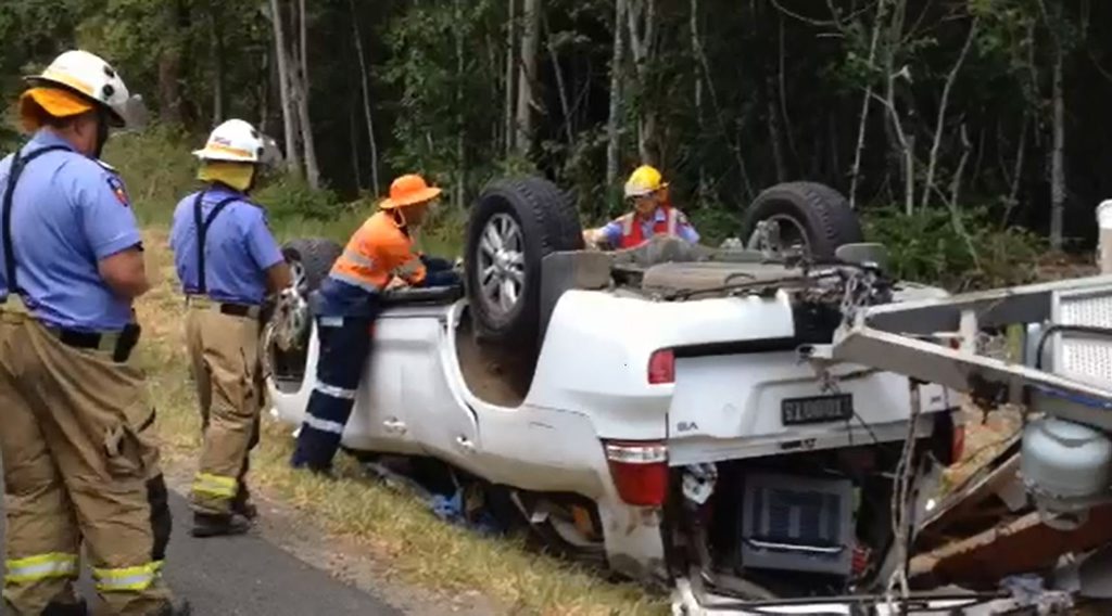 Car and caravan roll on Bruce Hwy. Car and caravan roll on Bruce Hwy.