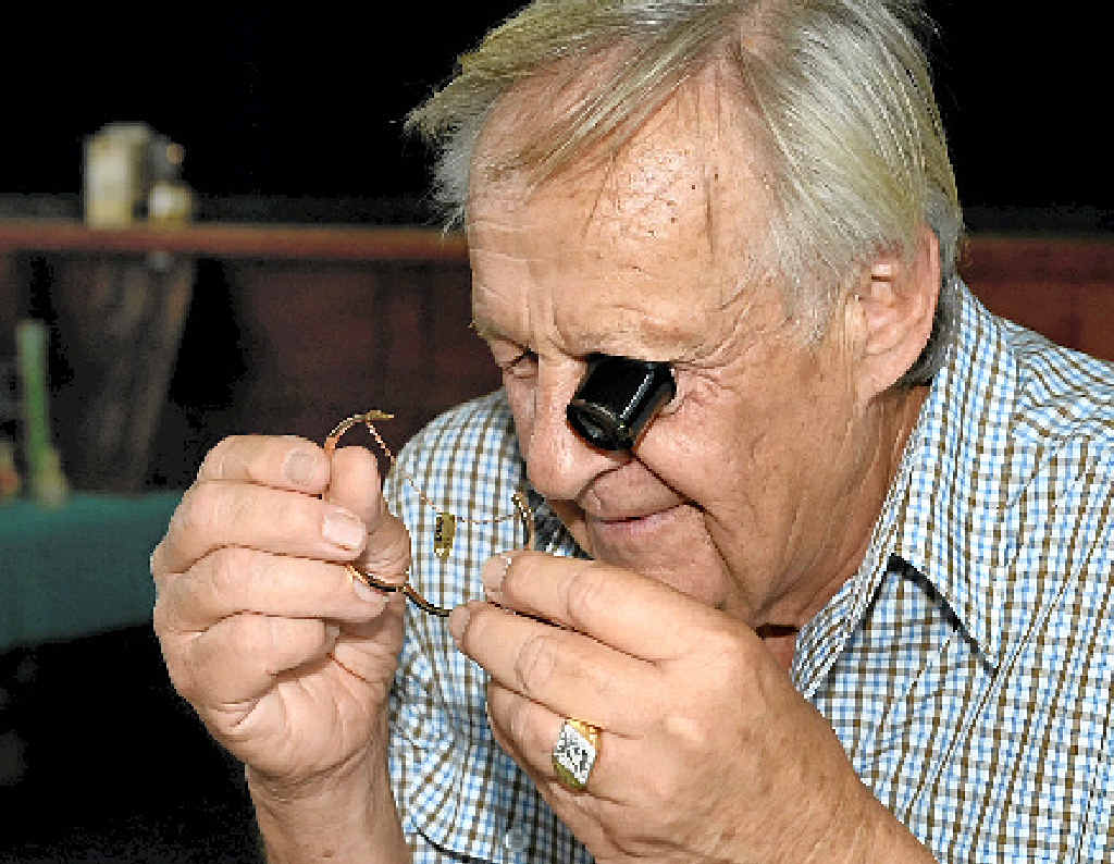 Bob Goodyear checks the quality of a bracelet. Bob Goodyear checks the quality of a bracelet.