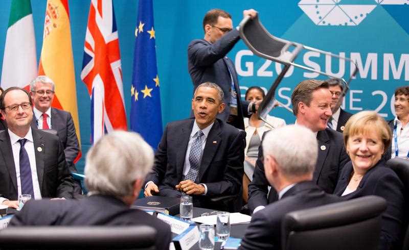 German Chancellor Angela Merkel (far R) chats with (clockwise from R) President of the European Council Herman van Rompuy, President of the European Commission Jean-Claude Juncker, French President Francois Hollande, US President Barack Obama and Birtish Prime Minister David Cameron during the USA-EU meeting at the G20 summit in Brisbane, Australia 16 November 2014. German Chancellor Angela Merkel (far R) chats with (clockwise from R) President of the European Council Herman van Rompuy, President of the European Commission Jean-Claude Juncker, French President Francois Hollande, US President Barack Obama and Birtish Prime Minister David Cameron during the USA-EU meeting at the G20 summit in Brisbane, Australia 16 November 2014.