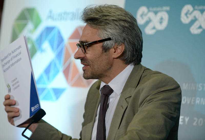 OECD Director of Tax Pascal Saint-Amans speaks to the media at a press conference during the G20 Finance Ministers and Central Bank Governors meeting in Sydney, Sunday, Feb. 23, 2014. OECD Director of Tax Pascal Saint-Amans speaks to the media at a press conference during the G20 Finance Ministers and Central Bank Governors meeting in Sydney, Sunday, Feb. 23, 2014.