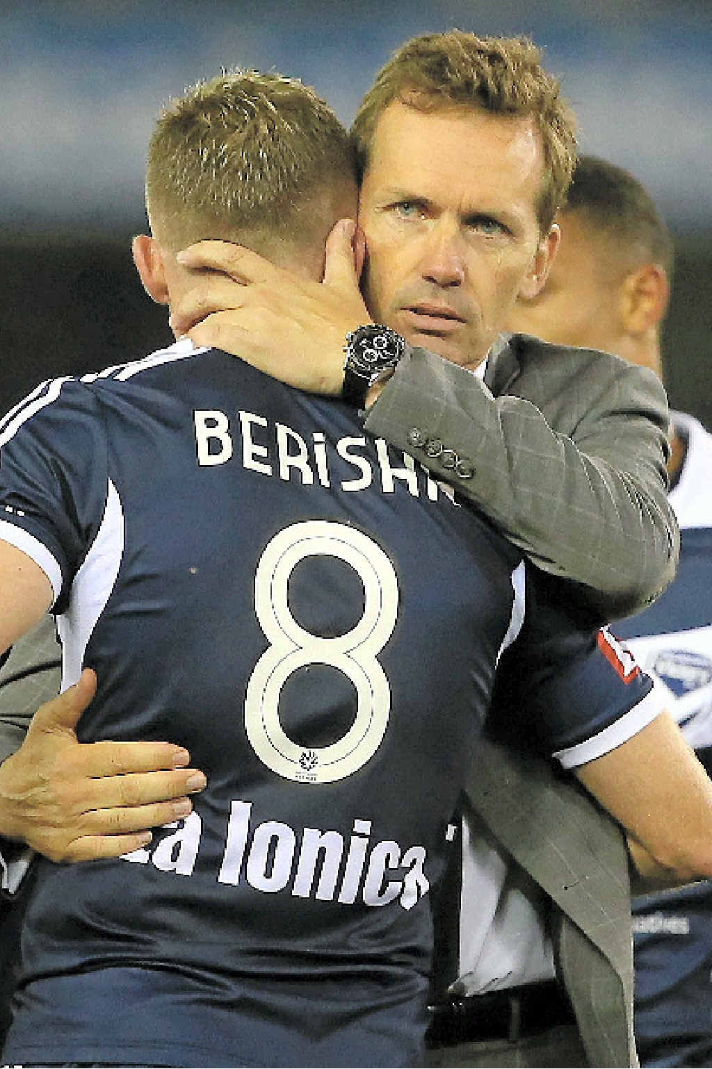 LAST GOODBYE: Victory’s Besart Berisha embraces his former coach, the Roar’s Mike Mulvey, after the clash at Etihad Stadium on Friday night. LAST GOODBYE: Victory’s Besart Berisha embraces his former coach, the Roar’s Mike Mulvey, after the clash at Etihad Stadium on Friday night.