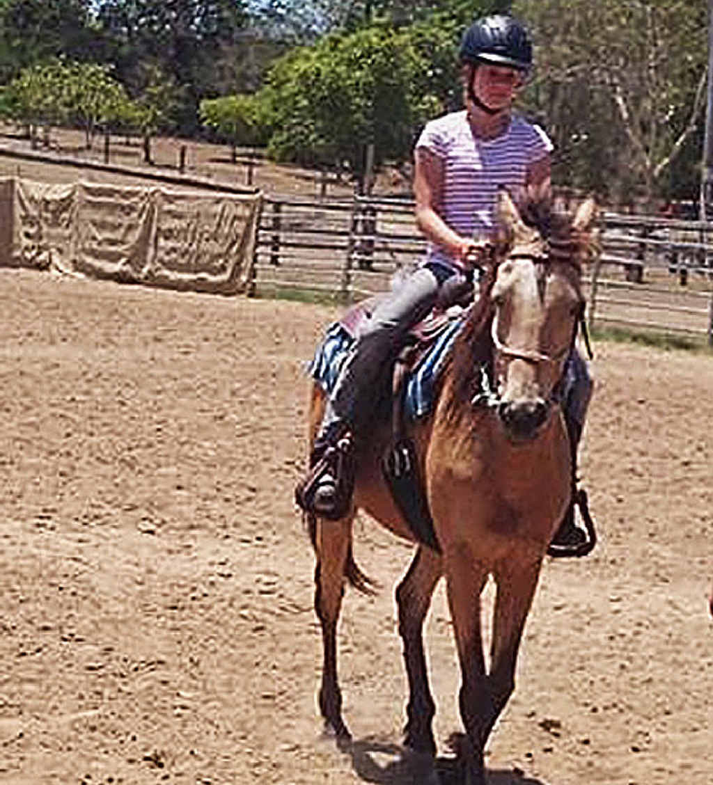 IN THE SADDLE: Cowgirl Meagan Neumann on a horse at last and (inset) on her dairy cow. IN THE SADDLE: Cowgirl Meagan Neumann on a horse at last and (inset) on her dairy cow.