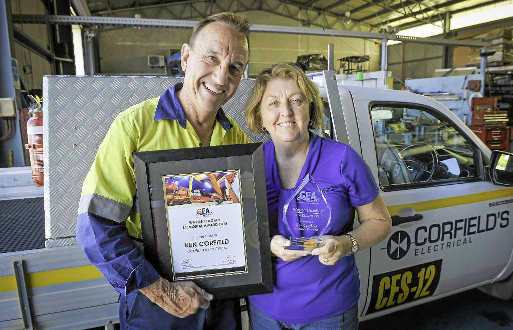 TOP GONG: Ken Corfield, pictured with wife Val who also works at Corfield’s Electrical Service, picked up this year’s Gladstone Engineering Alliance Wayne Peachey Memorial Award. TOP GONG: Ken Corfield, pictured with wife Val who also works at Corfield’s Electrical Service, picked up this year’s Gladstone Engineering Alliance Wayne Peachey Memorial Award.