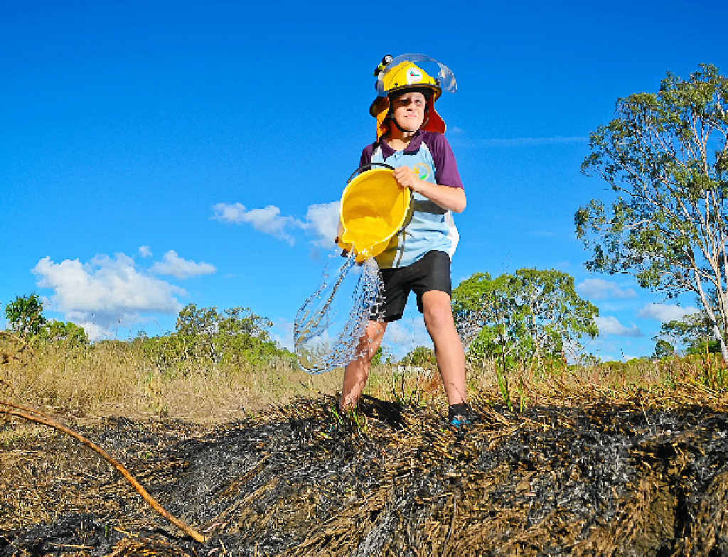 Eli Lee, 11, raised the alarm and used buckets to help put out a fire at Calliope. Eli Lee, 11, raised the alarm and used buckets to help put out a fire at Calliope.