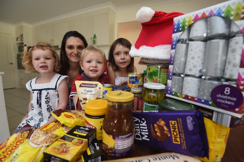 Melissa Wilkins, with her children Lilly, 4, Jacob, 2, and Anika, 3, posts on Facebook's Freecycle to give away $300 dollars worth of groceries to help needy families stock up for Christmas. Melissa Wilkins, with her children Lilly, 4, Jacob, 2, and Anika, 3, posts on Facebook's Freecycle to give away $300 dollars worth of groceries to help needy families stock up for Christmas.