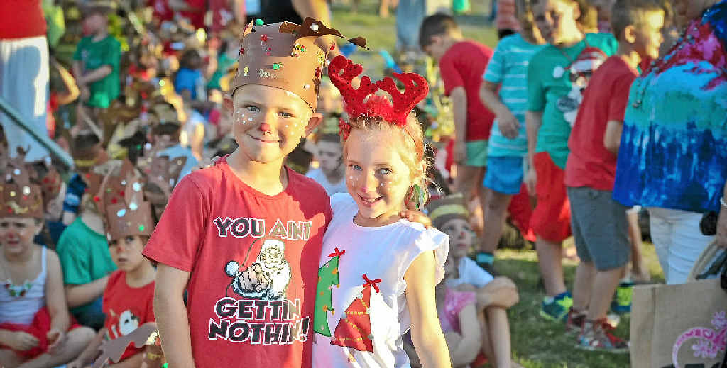 FESTIVE: Aidan Beevers, 5, and Annabelle Bailey, 6, from Prep C at Calliope State School ready to sing Christmas carols. FESTIVE: Aidan Beevers, 5, and Annabelle Bailey, 6, from Prep C at Calliope State School ready to sing Christmas carols.