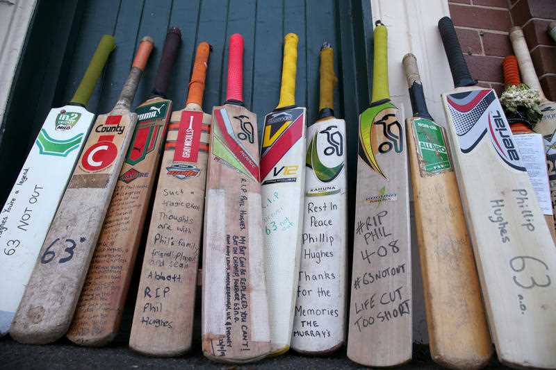 A row of bats with messages are lined up as a tribute for Phillip Hughes at the Sydney Cricket Ground. A row of bats with messages are lined up as a tribute for Phillip Hughes at the Sydney Cricket Ground.
