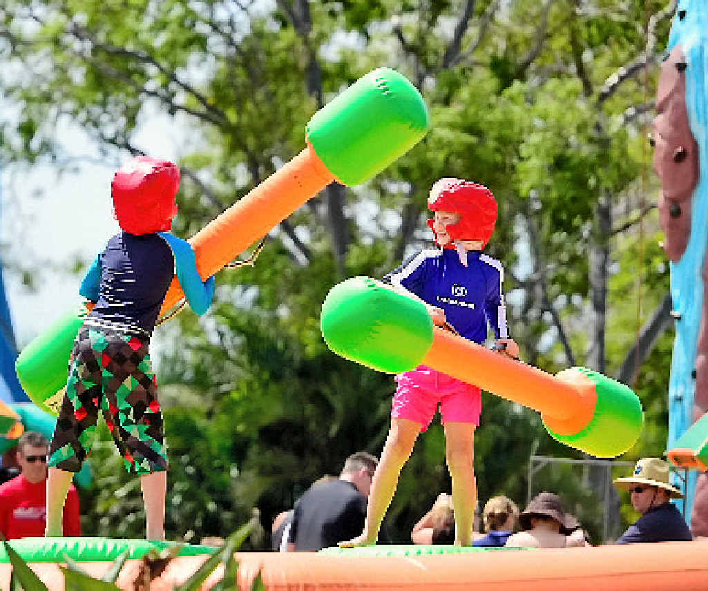 CHRISTMAS BASH: Bradley Jones, 11, and Jack Hoffman, 10, battle it out with fighting sticks at the Boyne Smelters Ltd Social Club Christmas Party. CHRISTMAS BASH: Bradley Jones, 11, and Jack Hoffman, 10, battle it out with fighting sticks at the Boyne Smelters Ltd Social Club Christmas Party.