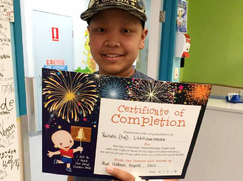 HOME FOR CHRISTMAS: Ping Chomkiattikun displays a certificate signalling his chemotherapy treatment is complete. HOME FOR CHRISTMAS: Ping Chomkiattikun displays a certificate signalling his chemotherapy treatment is complete.