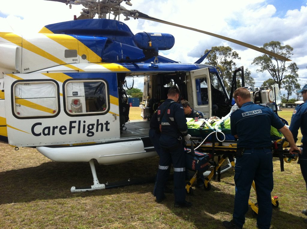 RACQ CareFlight crews transport a man injured during a campdraft event near Miles. Photo Contributed by RACQ CareFlight RACQ CareFlight crews transport a man injured during a campdraft event near Miles. Photo Contributed by RACQ CareFlight
