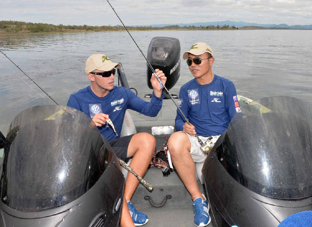GOING FISHING: Barra anglers Carl Jocumsen, of Toowoomba, and Chinese competitor Haiyang Li, team up in the inaugural International Fishing Series at Kinchant Dam. GOING FISHING: Barra anglers Carl Jocumsen, of Toowoomba, and Chinese competitor Haiyang Li, team up in the inaugural International Fishing Series at Kinchant Dam.