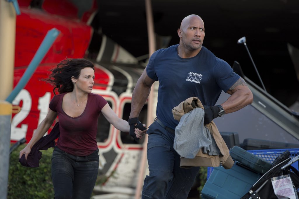 ON THE MOVE: Carla Gugino and Dwayne 'The Rock' Johnson in a scene from the movie San Andreas. Jasin Boland ON THE MOVE: Carla Gugino and Dwayne 'The Rock' Johnson in a scene from the movie San Andreas. Jasin Boland