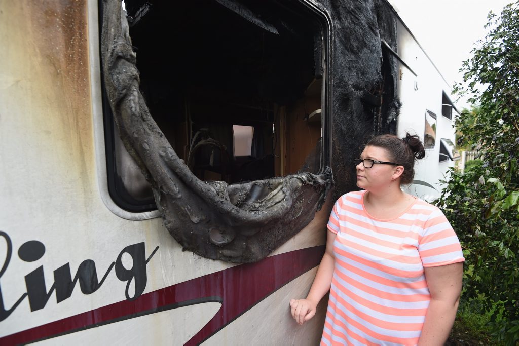 Abby Nelson next to her parents caravan that was extensively damaged by fire at their home in Eli Waters. Abby Nelson next to her parents caravan that was extensively damaged by fire at their home in Eli Waters.