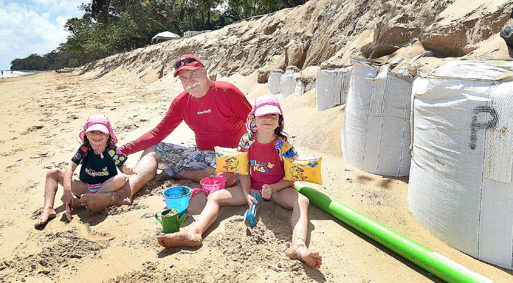 Paul Gurieff from Brisbane with Danish granddaughters Asta and Eva Gurieff enjoy play time on Torquay Beach, where sandbags installed last summer have been exposed by erosion. Paul Gurieff from Brisbane with Danish granddaughters Asta and Eva Gurieff enjoy play time on Torquay Beach, where sandbags installed last summer have been exposed by erosion.