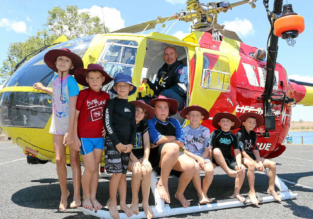 ON THE WATER: Mt Tarampa students checked out the Surf Life Saving Queensland rescue chopper with pilot George Levett, during the annual Seqwater Play it Safe day on Wivenhoe Dam on Wednesday, December 3. ON THE WATER: Mt Tarampa students checked out the Surf Life Saving Queensland rescue chopper with pilot George Levett, during the annual Seqwater Play it Safe day on Wivenhoe Dam on Wednesday, December 3.