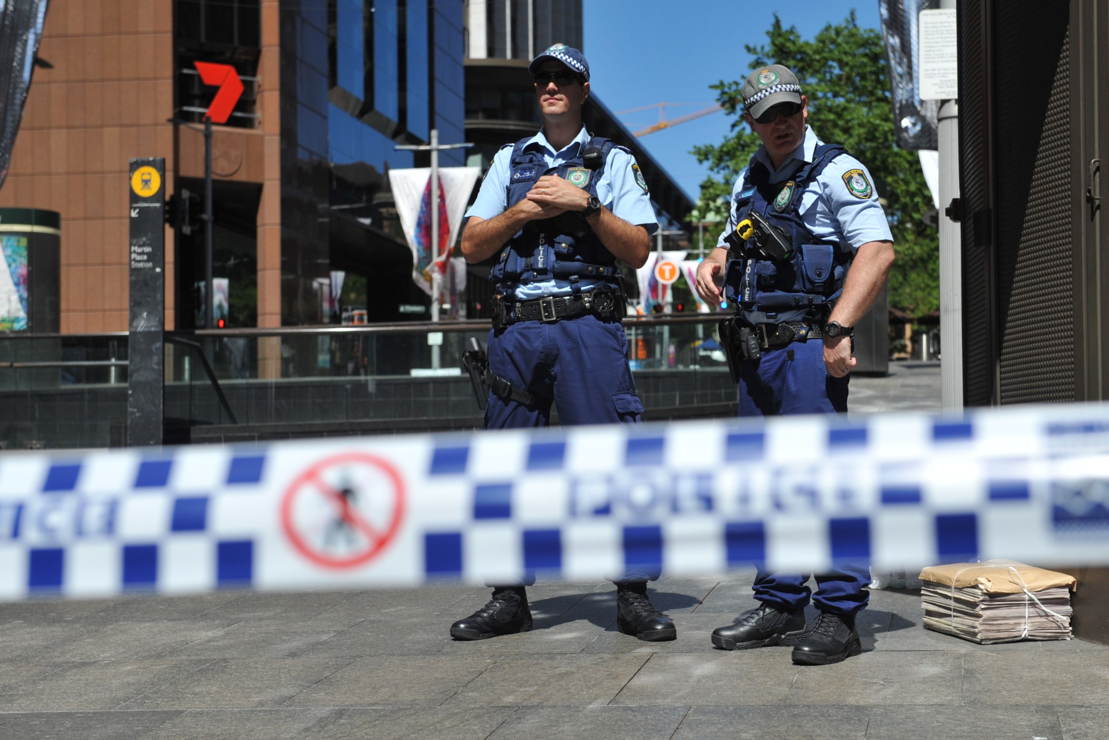 NSW Police are seen in Martin Place near the Lindt Cafe in the central business district of Sydney, Monday, Dec. 15, 2014. (AAP Image/Joel Carrett) NSW Police are seen in Martin Place near the Lindt Cafe in the central business district of Sydney, Monday, Dec. 15, 2014. (AAP Image/Joel Carrett)