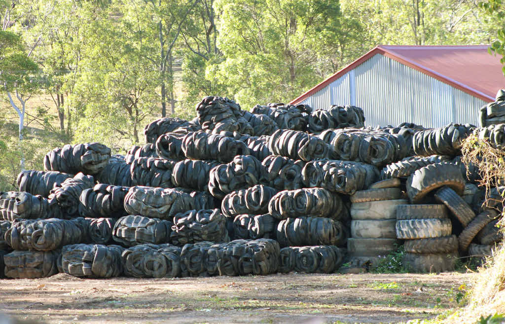 MAJOR ISSUE: A large stockpile of used car and truck tyres and other items are stored at this Kholo property. MAJOR ISSUE: A large stockpile of used car and truck tyres and other items are stored at this Kholo property.
