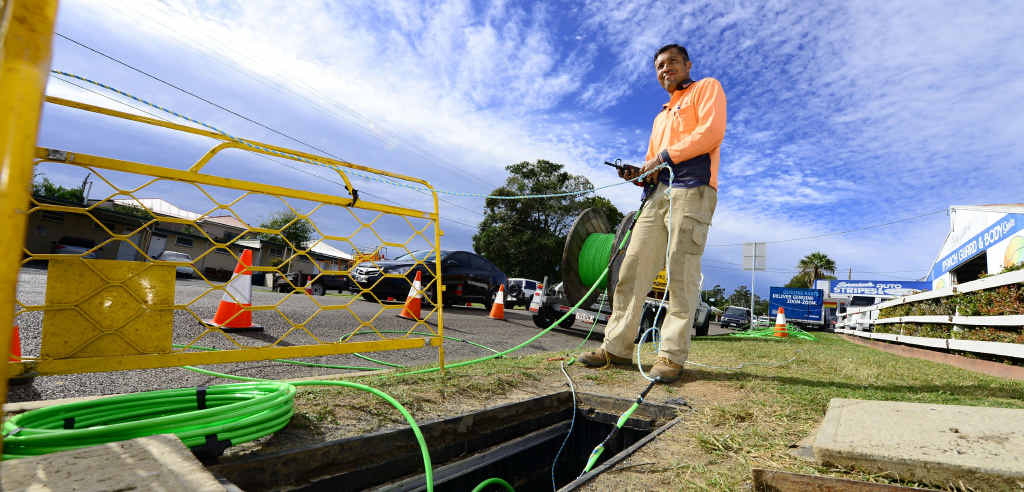 ROLLOUT: A Casatel employee is laying down fibre optic cable as part of the NBN rollout in West Ipswich. ROLLOUT: A Casatel employee is laying down fibre optic cable as part of the NBN rollout in West Ipswich.