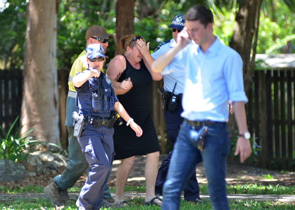 Police comfort a distressed woman at the scene where eight children aged between 18 months and 15 years were found dead. Police comfort a distressed woman at the scene where eight children aged between 18 months and 15 years were found dead.