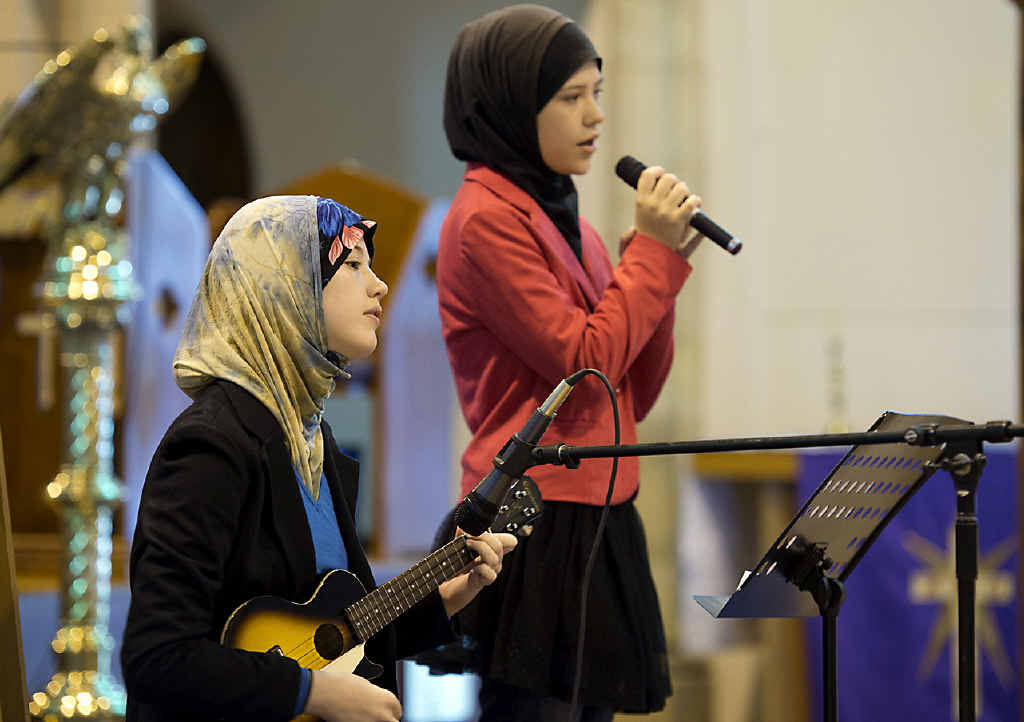 PROMOTING HARMONY: Sisters Jadzia (left) and Brittania Clifford-Pugh perform John Lennon’s song Imagine. PROMOTING HARMONY: Sisters Jadzia (left) and Brittania Clifford-Pugh perform John Lennon’s song Imagine.