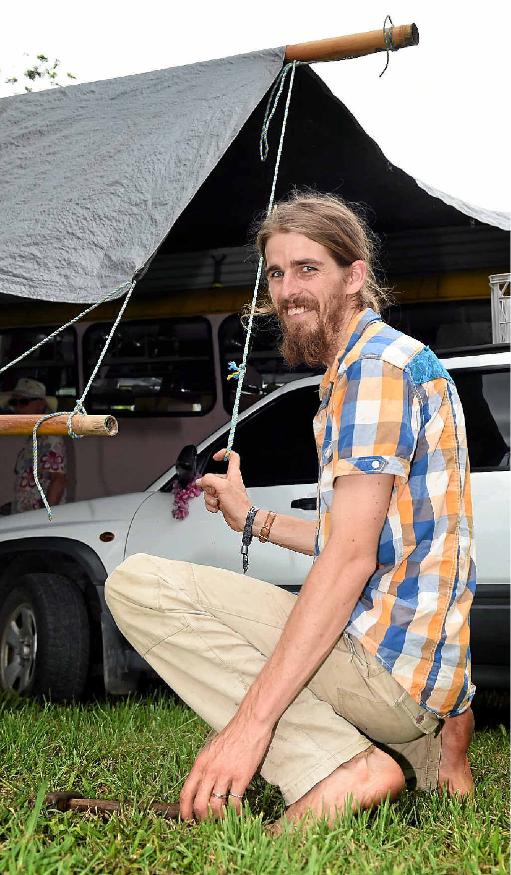 KEEN FAN: Ira Hodgkins, from Kiel Mountain, puts the finishing touches on the campsite at Woodford Folk Festival. KEEN FAN: Ira Hodgkins, from Kiel Mountain, puts the finishing touches on the campsite at Woodford Folk Festival.