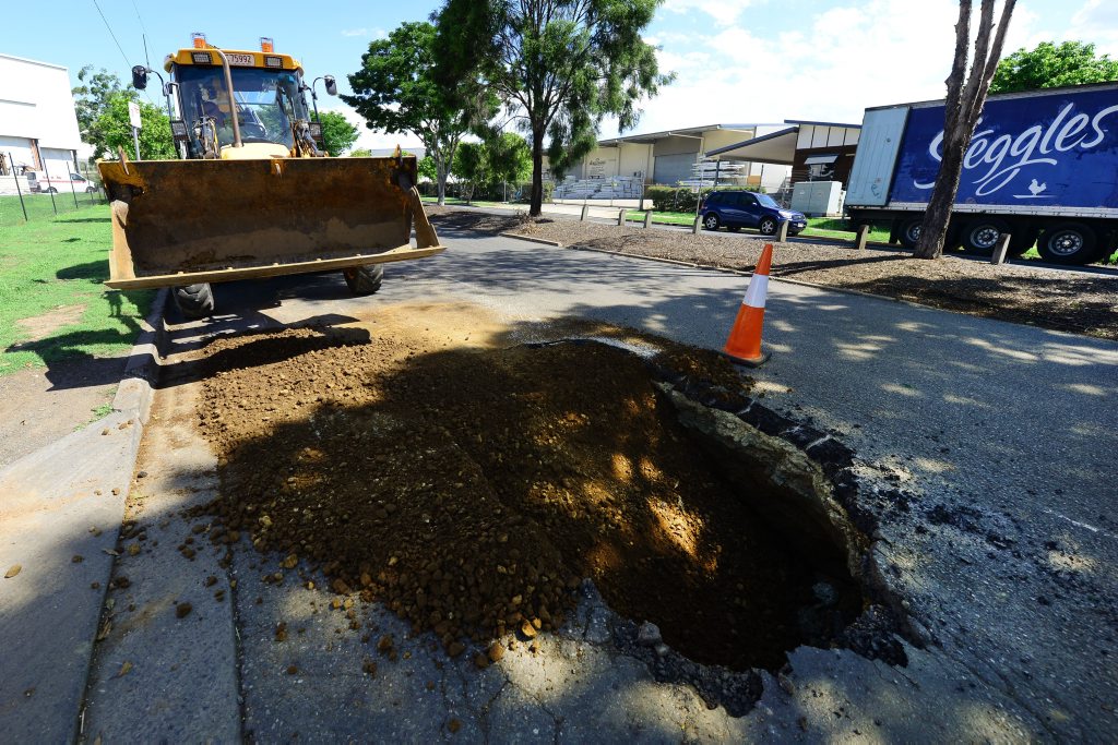 Ipswich City Council workers fix a large sinkhole appeared on Toongarra Road at Wulkuraka. Photo: David Nielsen / The Queensland Times Ipswich City Council workers fix a large sinkhole appeared on Toongarra Road at Wulkuraka. Photo: David Nielsen / The Queensland Times