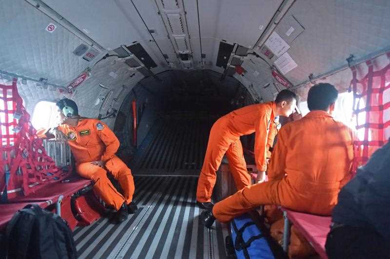 Items resembling an emergency slide, plane door and other objects were spotted in the sea during an aerial search on December 30 for missing AirAsia flight QZ8501, Indonesian officials said. Items resembling an emergency slide, plane door and other objects were spotted in the sea during an aerial search on December 30 for missing AirAsia flight QZ8501, Indonesian officials said.