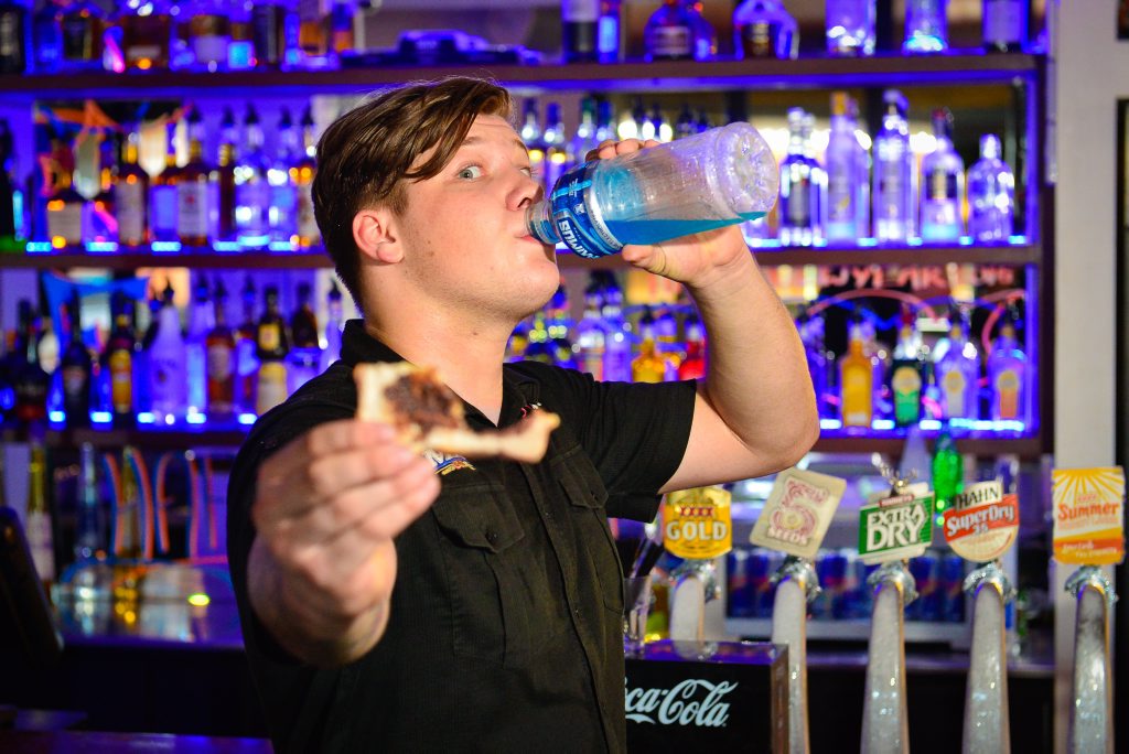 Bartender at the Reef Hotel Tom Warrington knows a hangover well and knows how to cure it. Photo Mike Richards / The Observer Bartender at the Reef Hotel Tom Warrington knows a hangover well and knows how to cure it. Photo Mike Richards / The Observer