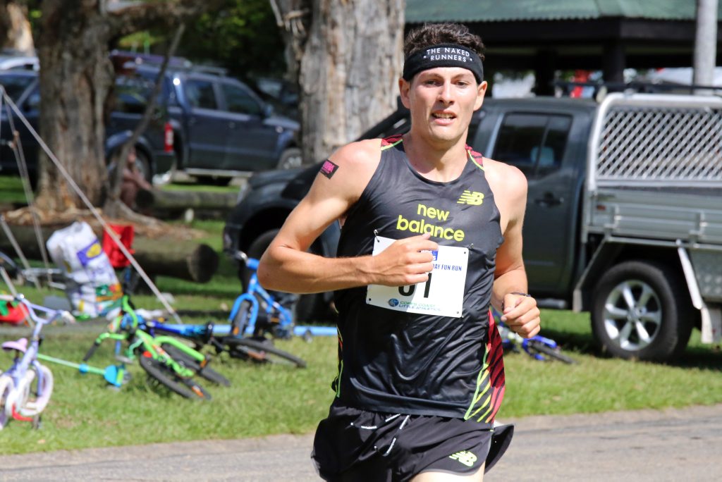 Jordan Gusman was racing against the clock as he crossed the line first in this morning's Sawtell Fun Run. Photo: Gemima Harvey/Coffs Coast Advocate Jordan Gusman was racing against the clock as he crossed the line first in this morning's Sawtell Fun Run. Photo: Gemima Harvey/Coffs Coast Advocate