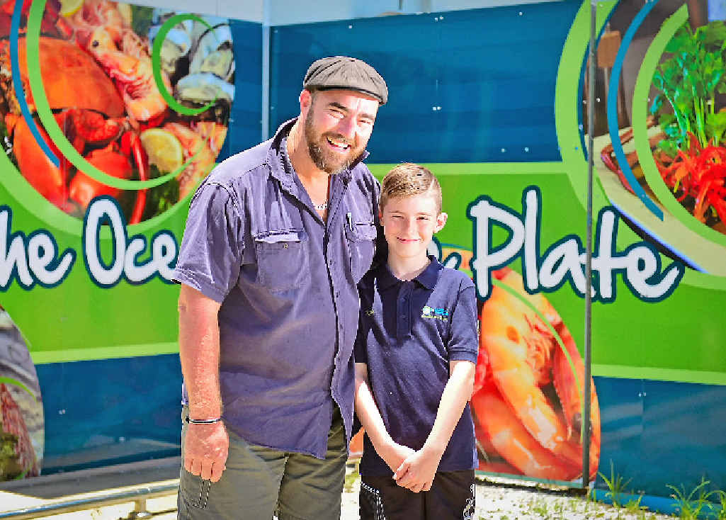 Gladstone Fish Market owner Simon Wittingham and his son Kyle, 9, were all smiles after a belter of a Christmas period despite the competition. Gladstone Fish Market owner Simon Wittingham and his son Kyle, 9, were all smiles after a belter of a Christmas period despite the competition.