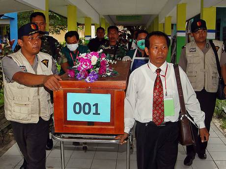 A coffin of a victim of AirAsia flight QZ8501 is transferred from a local hospital in Pangkalan Bun, the town with the nearest airstrip to the crash site of AirAsia flight QZ8501, in Central Kalimantan A coffin of a victim of AirAsia flight QZ8501 is transferred from a local hospital in Pangkalan Bun, the town with the nearest airstrip to the crash site of AirAsia flight QZ8501, in Central Kalimantan