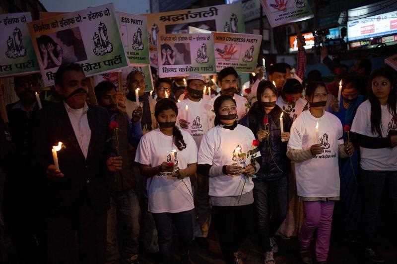 Indian political and civil society activists take part in a vigil to mark the second anniversary of the fatal gang-rape of a student in the Indian capital, at the bus stop in the Munirka area of New Delhi on December 16, 2014. Indian political and civil society activists take part in a vigil to mark the second anniversary of the fatal gang-rape of a student in the Indian capital, at the bus stop in the Munirka area of New Delhi on December 16, 2014.