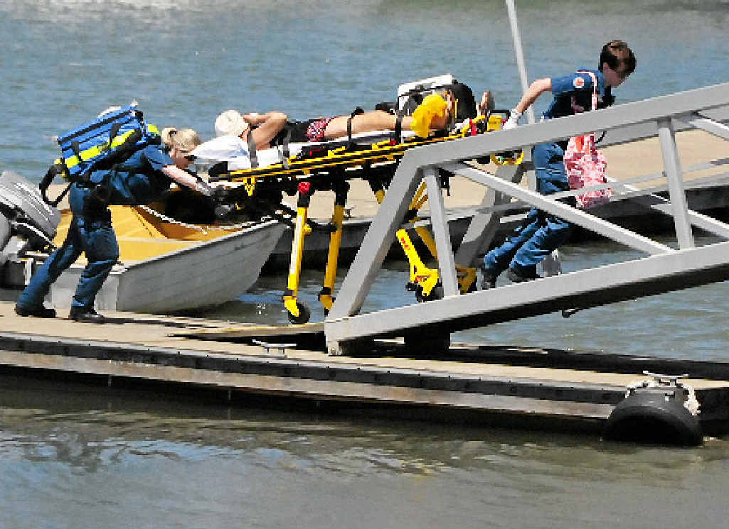 A woman suffering from a severe reaction to a possible marine stinger encounter is taken from Gladstone Marina to hospital via ambulance on Sunday. A woman suffering from a severe reaction to a possible marine stinger encounter is taken from Gladstone Marina to hospital via ambulance on Sunday.