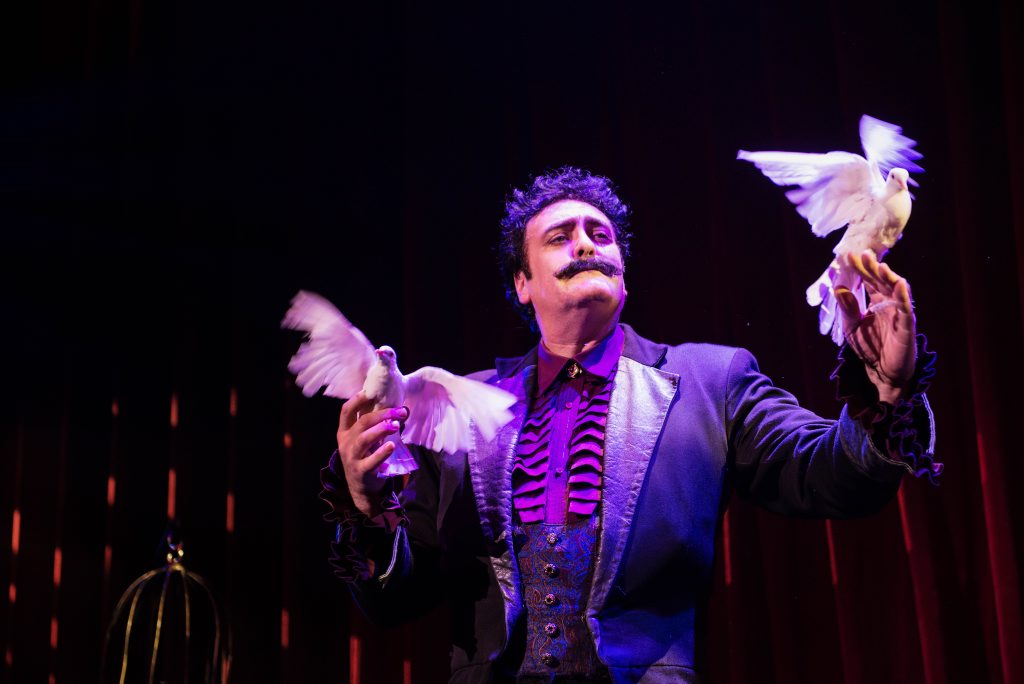 The Immortal Rick Thomas makes doves appear in the opening performance of The Illusionists 1903 at QPAC's Concert Hall. The Immortal Rick Thomas makes doves appear in the opening performance of The Illusionists 1903 at QPAC's Concert Hall.