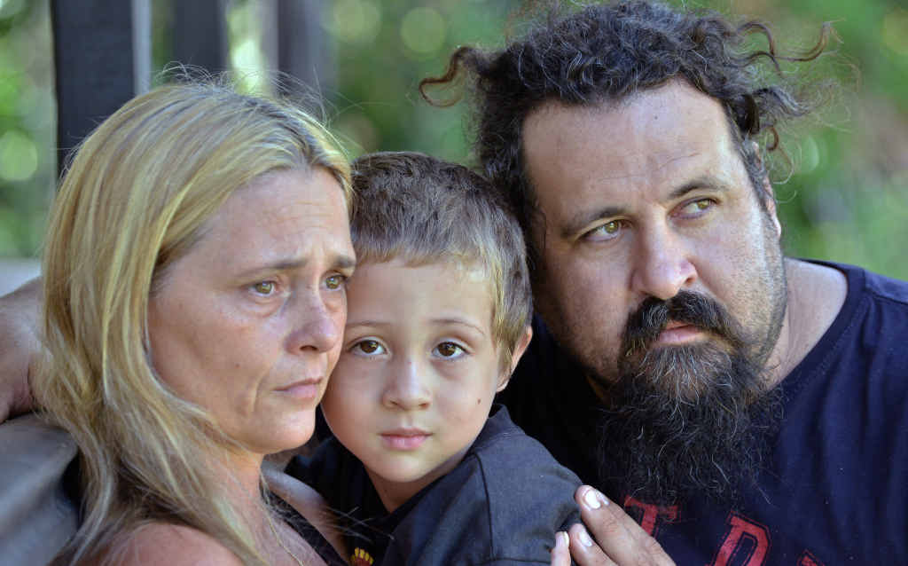 ESCAPE ARTIST: Aiden Buckley, 5, with his parents Sharon Gardner and Michael Buckley. ESCAPE ARTIST: Aiden Buckley, 5, with his parents Sharon Gardner and Michael Buckley.
