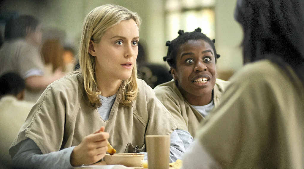 DRAMEDY: Taylor Schilling and Uzo Aduba in a scene from the TV series Orange is the New Black. DRAMEDY: Taylor Schilling and Uzo Aduba in a scene from the TV series Orange is the New Black.