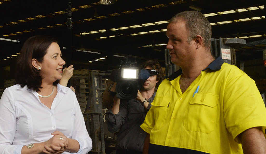DOWN TO BUSINESS: Annastacia Palaszczuk meets employee Jamie Costin during her tour of Claypave yesterday. DOWN TO BUSINESS: Annastacia Palaszczuk meets employee Jamie Costin during her tour of Claypave yesterday.