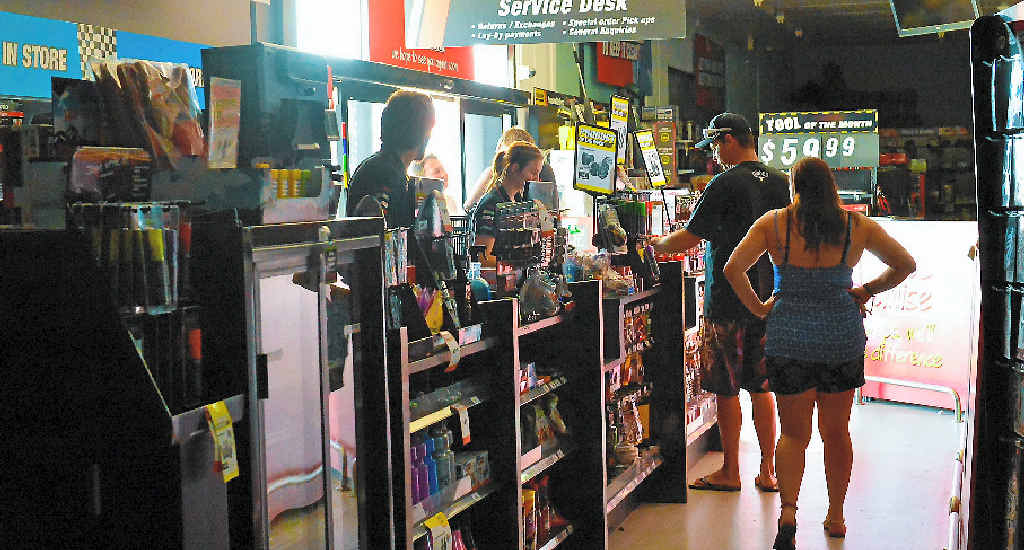 Customers Shop By Torchlight As Power Goes Out Observer