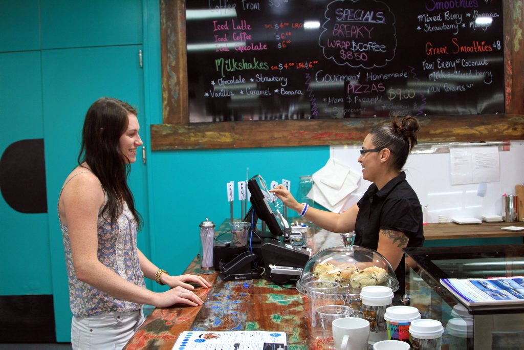 Karlie Morrison chats with barista Caela Walker at the new cafe inside Pialba's Open House. Karlie Morrison chats with barista Caela Walker at the new cafe inside Pialba's Open House.