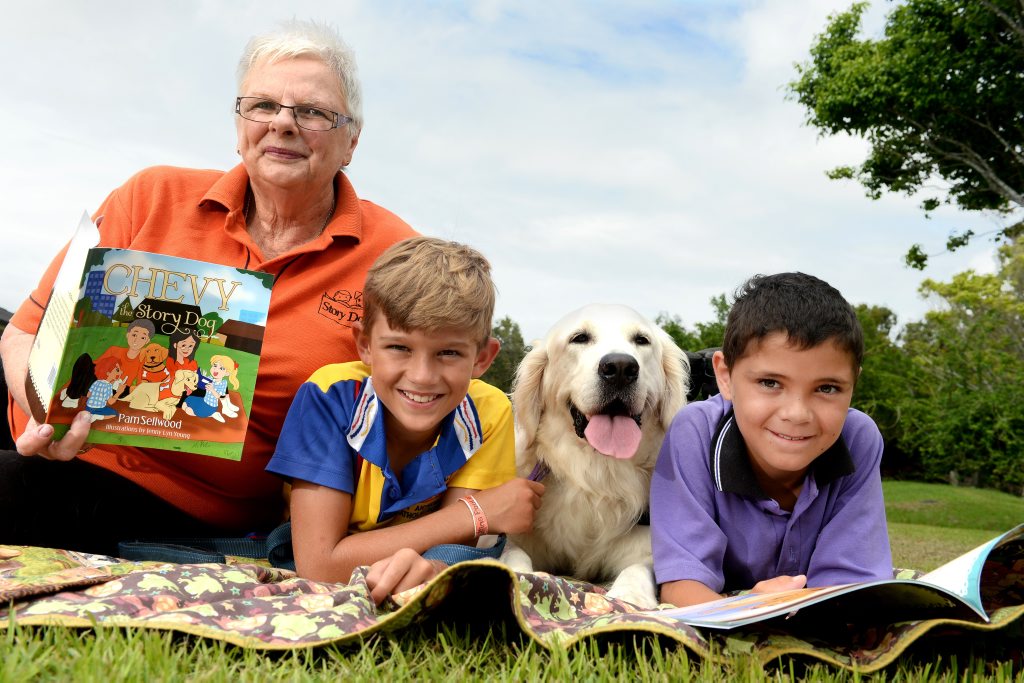Pam Sellwood, Blake Nelson (St Anthony's Kingscliff), Chevy and Ned Atkins (Pottsville Beach Public School) read the new book abouy Chevy the story dog. Photo: John Gass / Tweed Daily News Pam Sellwood, Blake Nelson (St Anthony's Kingscliff), Chevy and Ned Atkins (Pottsville Beach Public School) read the new book abouy Chevy the story dog. Photo: John Gass / Tweed Daily News