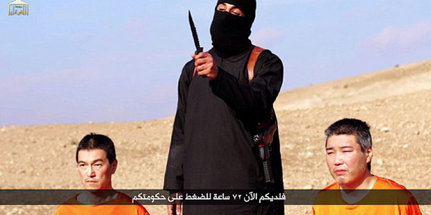 A jihadi threatens Kenji Goto Jogo and Haruna Yukawa in a video Isis released earlier this week. A jihadi threatens Kenji Goto Jogo and Haruna Yukawa in a video Isis released earlier this week.