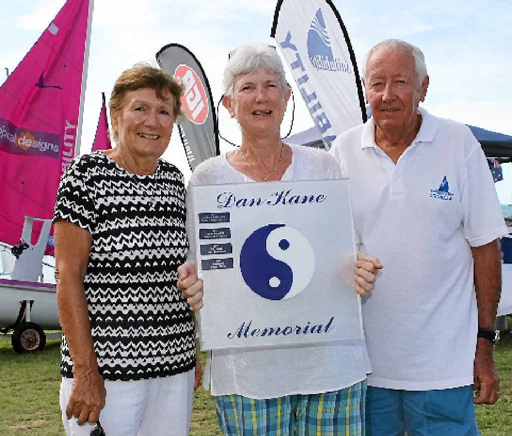 PAYING TRIBUTE: Whitsunday Sailing Club Yachtsperson of the year Heather Sutton (centre), was presented with the Dan Kane Memorial Trophy by Dan’s parents Mim and John Kane (left and right) at the club on Australia Day. PAYING TRIBUTE: Whitsunday Sailing Club Yachtsperson of the year Heather Sutton (centre), was presented with the Dan Kane Memorial Trophy by Dan’s parents Mim and John Kane (left and right) at the club on Australia Day.