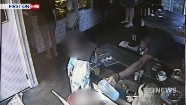 Jason Deller pours a jug of water over his child at a cafe. Image: Nine News Jason Deller pours a jug of water over his child at a cafe. Image: Nine News